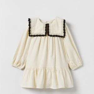 Chic Cream Dress with Black Trim